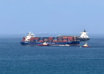 Iran and Oman officials meet to discuss the future administration of the Strait of Hormuz following a preliminary US-Iran peace agreement.